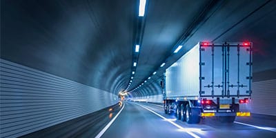 truck driving through tunnel