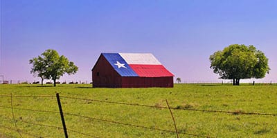 barn with texas flag on roof