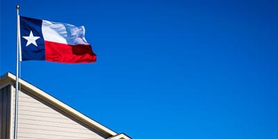 texas flag over a business